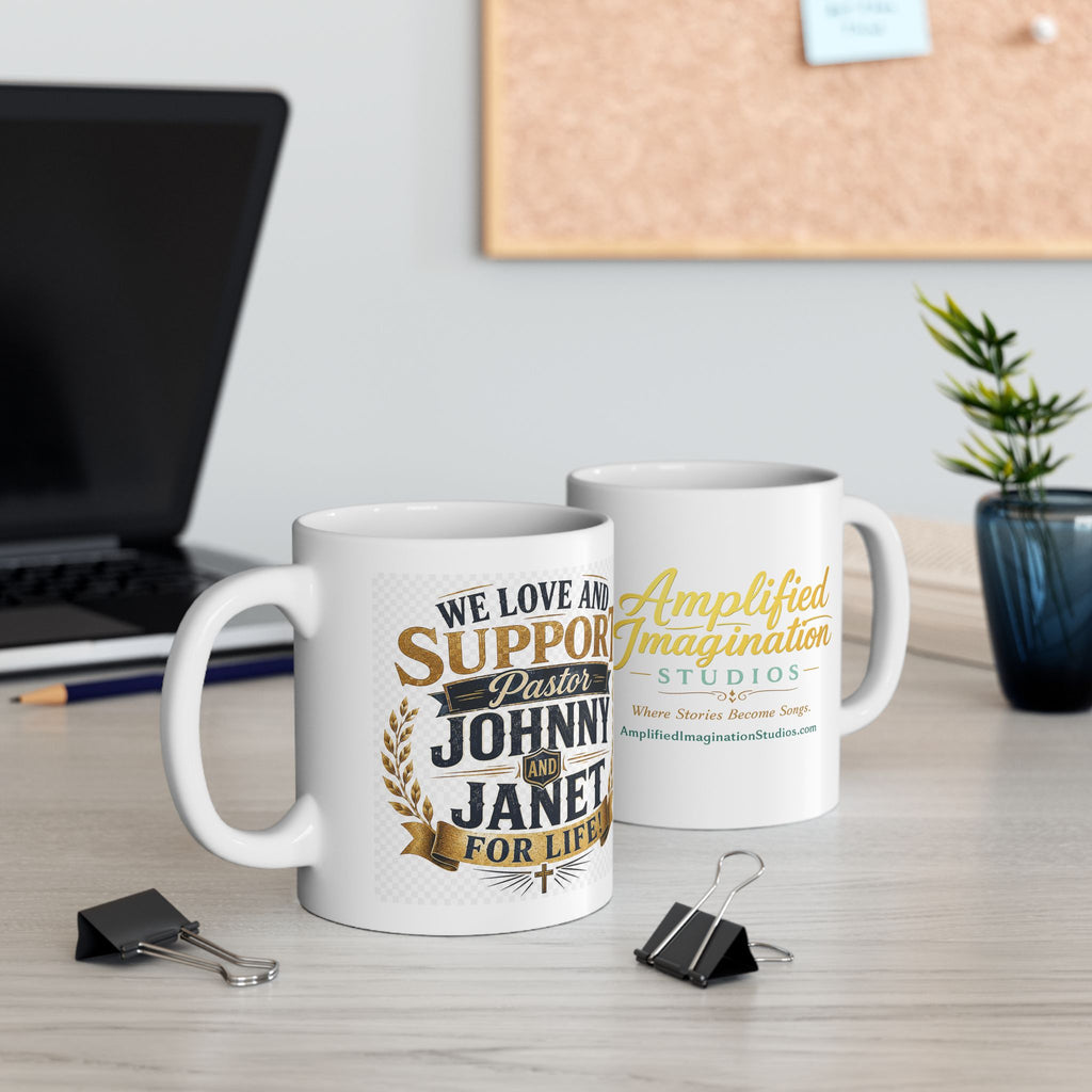 Two mugs with printed text We Love and Support Johnny and Janet for Life on a desk with office supplies and decor.
