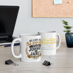 Two mugs with printed text We Love and Support Johnny and Janet for Life on a desk with office supplies and decor.