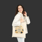 Woman holding a tote bag with text and floral design on a white background