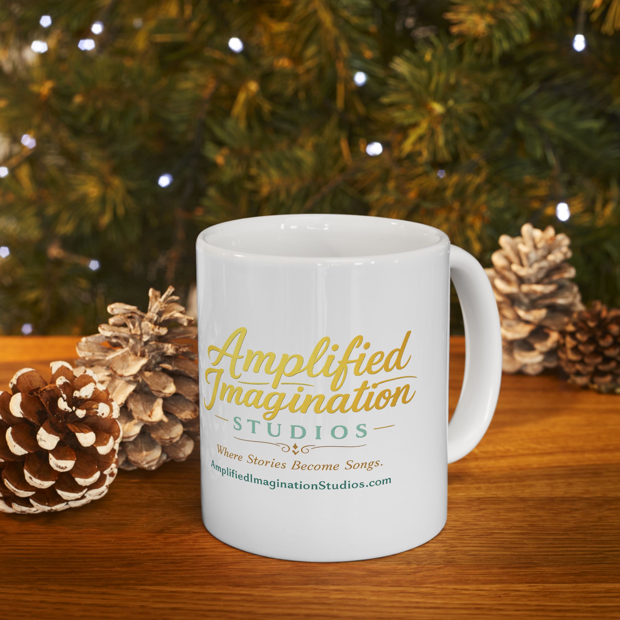 White mug with AIS text on a wooden surface with pinecones and a Christmas tree in the background.