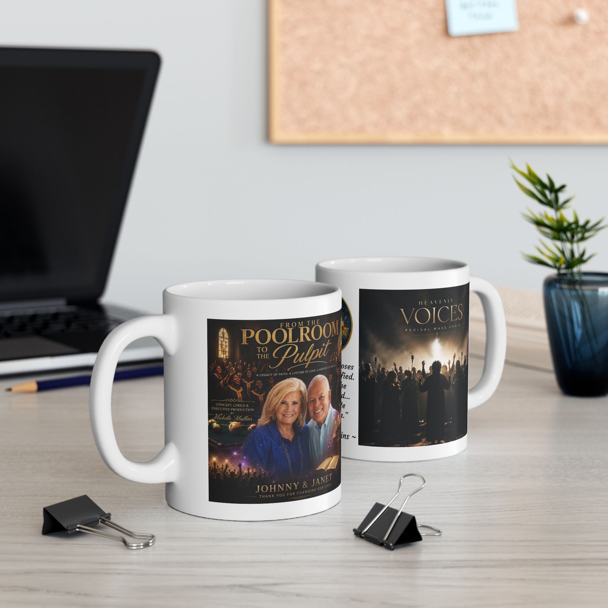 Two mugs with printed designs on a desk with office items.