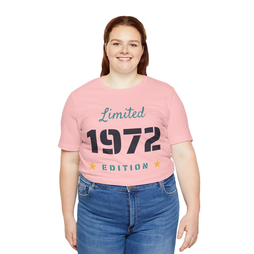 Person wearing a pink t-shirt with 'Limited 1972 Edition' text on a white background