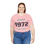 Person wearing a pink t-shirt with 'Limited 1972 Edition' text on a white background